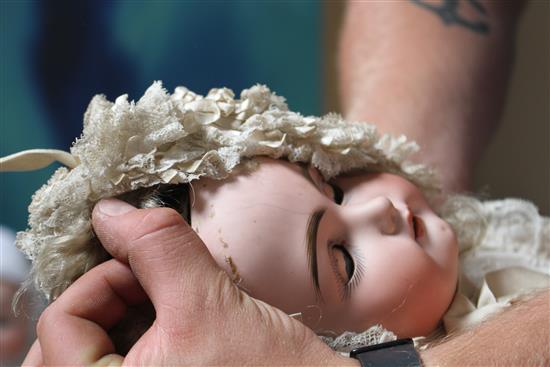 A Kestner 192 doll, fixed wrists, pierced ears and hairline to forehead, 24in.